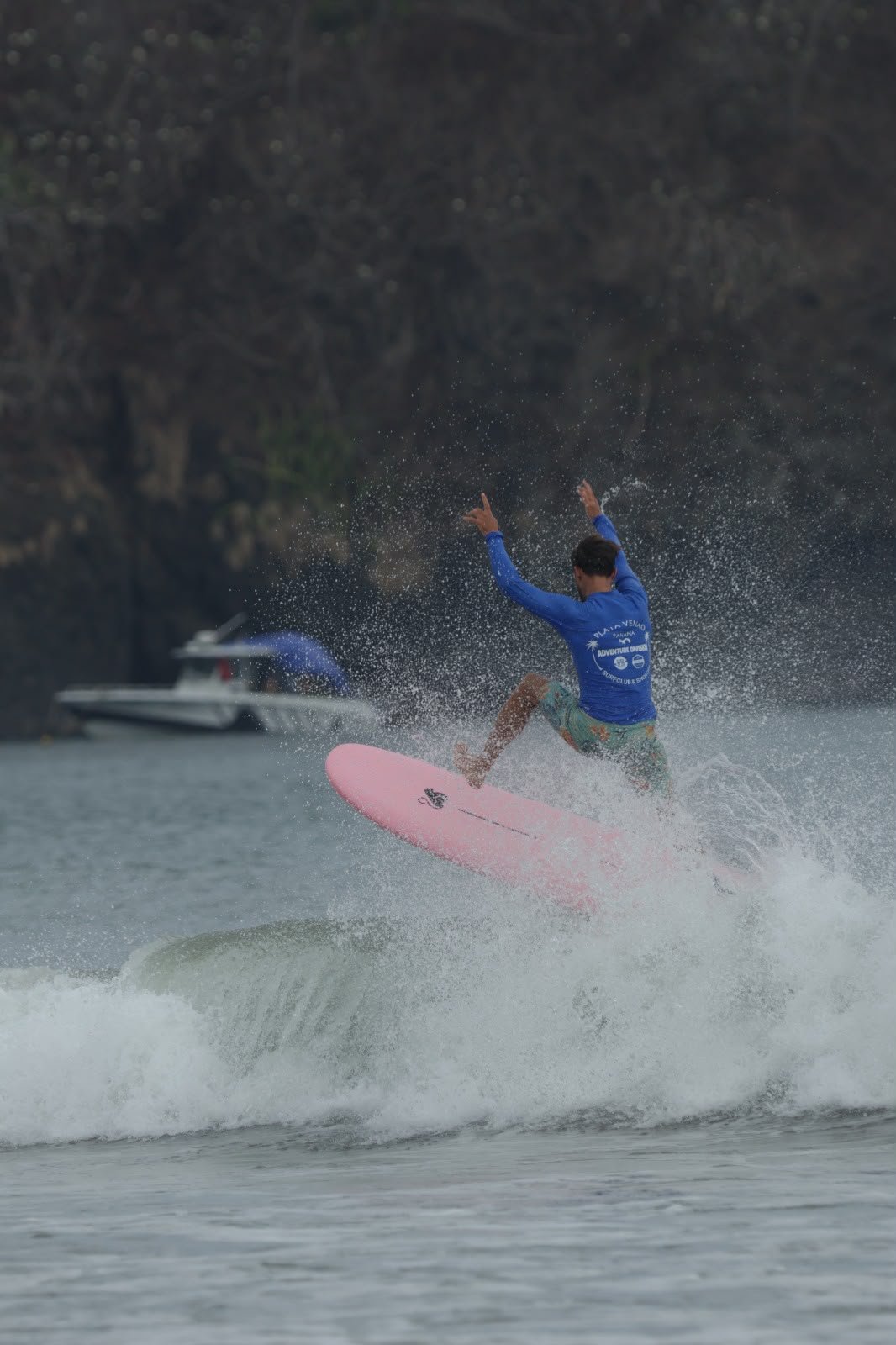 Surfer carving through ocean spray at Playa Venao